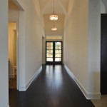 The foyer light was repeated down this long center hallway.  Home built by Canyon Custom Homes