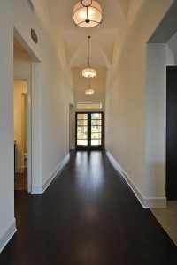 The foyer light was repeated down this long center hallway.  Home built by Canyon Custom Homes